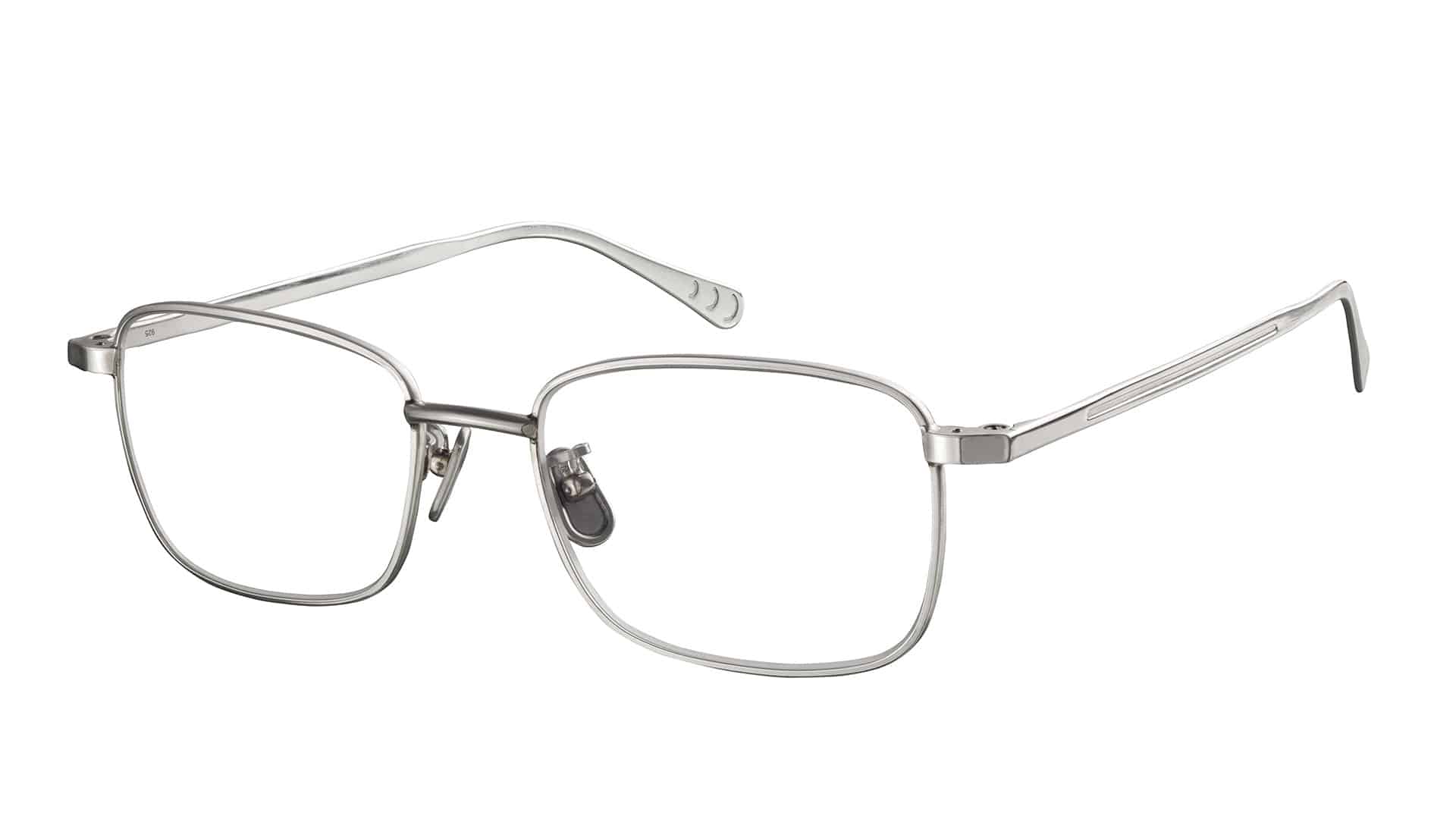 Moderne, randlose Brille auf Weiß.